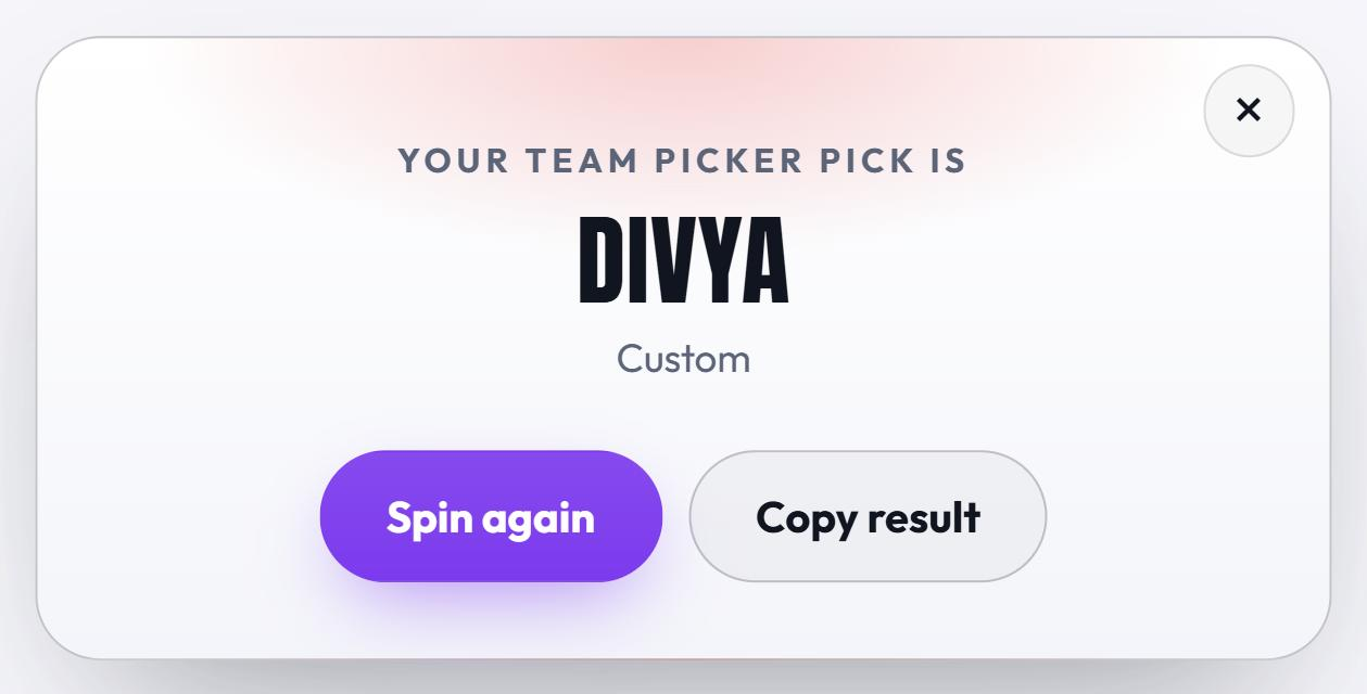 The Team Picker Wheel result card reading Your Team Picker pick is Divya, with a close button in the corner and Spin again and Copy result buttons underneath.
