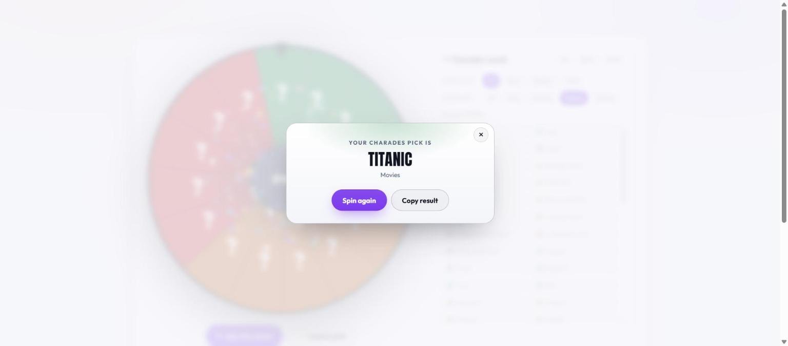 The charades result card reading Your Charades pick is Titanic, labelled Movies, with Spin again and Copy result buttons over the dimmed wheel whose words stay hidden behind question marks